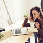 woman-having-drink-with-laptop-table_1048944-17539124