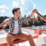 Young man kayaking and admiring the view