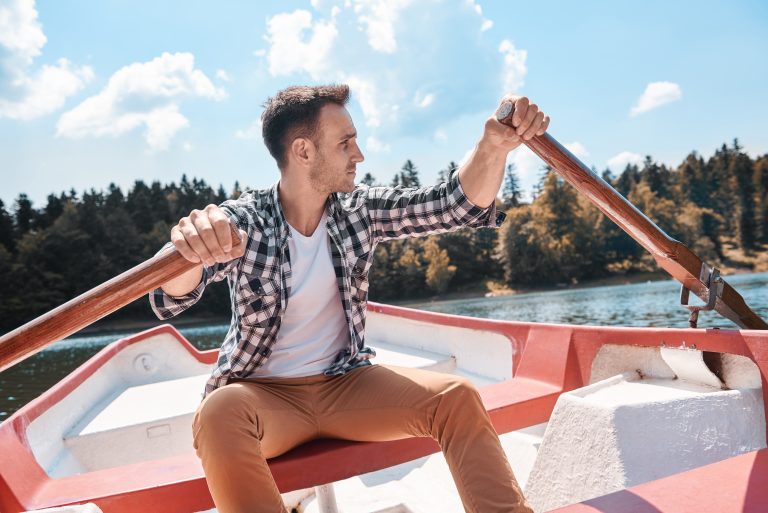 Young man kayaking and admiring the view